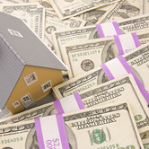 house-on-money-stacks-mortgage-rates-keyimage.jpg